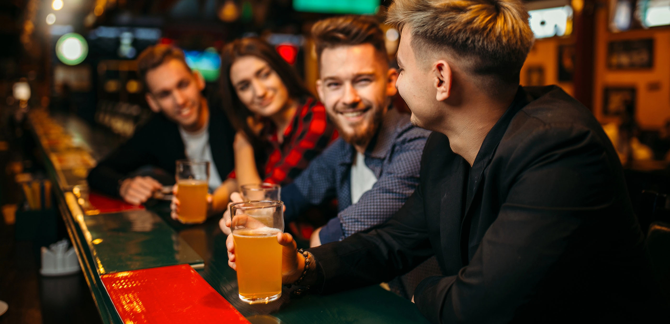 Friends smiling at the bar